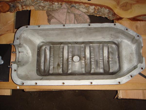 Cast aluminum oil pan & rod dipper tray.